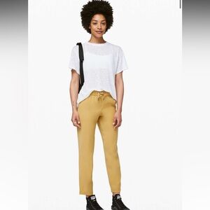 83. Lululemon $118 On the Fly 7/8 Pant *Woven Vintage Gold 4